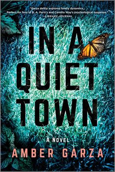 the cover of in a quiet town by amber garraa, with a butterfly on it