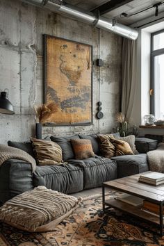 a living room filled with furniture and a large painting hanging on the wall above it