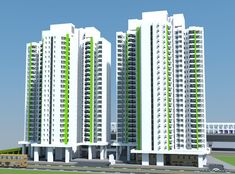 two tall buildings with green and white balconies next to each other in front of a parking lot