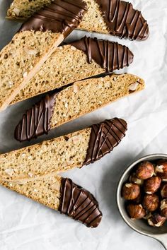 several pieces of bread with nuts and chocolate on top