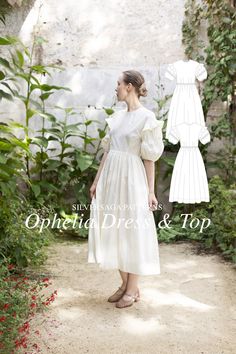 a woman wearing a white dress and sandals standing in front of an open - air garden