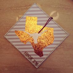 a square shaped ornament with the shape of a texas longhorn on it