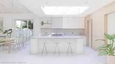 a white kitchen with an island in the middle and lots of counter space on each side