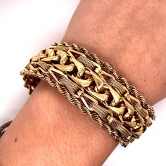 For Sale on 1stDibs - Vintage 1960s 14KY Gold Woven Wheat Link with Rope Edge Wide Charm Bracelet - The bracelet measure 7.15 inches long and 1 inch wide and features a hidden Rectangular Gold Bracelet With 17 Jewels, Retro Yellow Gold Bracelet For Formal Occasions, Retro Yellow Gold Bracelets For Formal Occasions, Vintage 14k Gold Chain Bracelet For Formal Occasions, Antique Gold Rectangular Bracelet, Vintage Yellow Gold Link Bracelets, Vintage Yellow Gold Link Bracelet, Vintage 14k Gold Jubilee Chain Bracelet, Vintage Yellow Gold Bracelet With Box Clasp