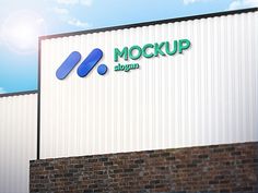 a sign on the side of a building that says mockup against a blue sky