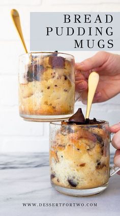 two jars filled with bread pudding sitting on top of a counter next to a hand holding a spoon