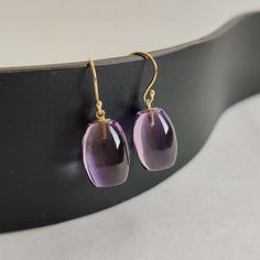 ITEM DESCRIPTION: >> The earrings are made from Solid 14K Yellow Gold. Gemstone used is absolutely natural and ethically sourced. >> Natural Amethyst in tube shape and drill setting is studded on it with utmost precision.  >> This is a minimalist design and is absolutely hassle-free and everyday jewelry.  Gem: Purple Amethyst Gem size & shape: 10 x15 mm and tube Gem weight: 24.75 cts Gold purity: 14K (58.33% approx.) Gold weight: 0.56 grams  Gross weight: 5.51 grams The Gold purity is guaranteed and it comes with authentic 14K gold hallmark. Since these Earrings are handmade, they are Nickel/Lead FREE.  CUSTOMIZATION: --> You can choose your own gemstone. --> Kindly drop a message for more options. CUSTOMER SUPPORT: --> We are available 24/7 to respond to all your queries!  PACKAGING: --> Luxury Amethyst Teardrop Earrings, Luxury Amethyst Earrings For Gift, Purple Briolette Fine Jewelry Earrings, Amethyst Briolette Earrings For Formal Occasions, Formal Amethyst Briolette Earrings, Amethyst Gemstone Earrings For Formal Occasions, Elegant Polished Amethyst Gemstones, Formal Amethyst Gemstone Earrings, Formal Amethyst Drop Earrings