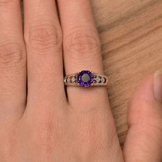 It is a natural amethyst ring, octagon cut, measures 7mm*7mm, weight about 1.46 cts. The basic metal is sterling silver and plated with rhodium. To change the metal to a solid gold (white/rose) or platinum is also available, please ask for a quotation if you want. You can also go to my shop Home for more elegant rings: https://www.etsy.com/shop/godjewelry?ref=hdr_shop_menu amethyst is birthstone of February More amethyst rings: https://www.etsy.com/shop/godjewelry?ref=seller-platform-mcnav&s Amethyst Rings, February Birthstone Ring, Elegant Rings, Amethyst Gem, Purple Band, February Birthstone, Elegant Ring, February Birth Stone, Vintage Ring