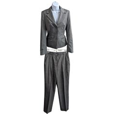 "Vintage Y2K ESCADA 2-piece Gray Herringbone Pinstripe Slim-Line Suit Single-Breasted Non-Boxy Size 34 Jacket Size 36 Pants Shell: 100% Pure New Wool (Virgin Wool) Lining: 100% Rayon/Viscose Absolutely *timeless* style - no massive shoulder pads, boxy fit, or oversized pockets. This is sleek, tailored, and quietly luxurious. Excellent Used Condition - basted front pocket seams still sealed. Truly practically mint except for two minor flaws: - Faded tags - Button on the left arm cuff chipped Suit has been steam cleaned and pressed. The color is a medium neutral gray with off-white herringbone pinstripes. The dark gray/brown 1.7cm logo buttons appear to be hematite - non-magnetic and polished iridescent on the surface. Uncuffed with blind hem stitching JACKET: Size 34 Single breasted Light s Oversized Pockets, Blind Hem, Clean And Press, White Herringbone, Slim Suit, Grey Herringbone, Arm Cuff, Evening Wear, Shoulder Pads