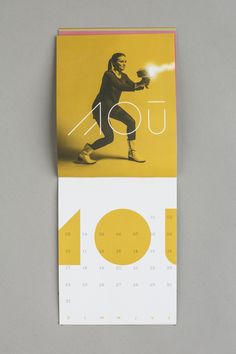 a calendar with an image of a woman holding a ball