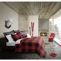 a bed room with a neatly made bed next to a window and a fire place