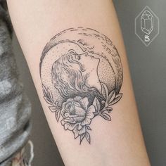 a woman's arm with a tattoo on it