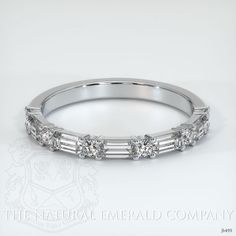 a white gold wedding band with baguetts set in the middle and diamonds on each side