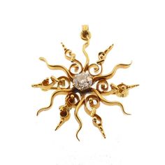 "A lovely Victorian starburst pendant worked in 14K yellow gold and set with an old mine cut diamond at the center. Stars in Victorian jewelry symbolized guidance and wisdom. Most Victorian starbursts have straight rays, but the Art Nouveau-influenced curlicue design of this example makes it especially nice. The diamond at the center has good brilliance, I/J color and VS1 clarity. The pendant retains the original brooch fitting, as well, but it is very well hidden when being worn as a pendant. T Starburst Pendant, Silver Dragon Necklace, Mystical Jewelry, Old Mine Cut Diamond, Antique Wax, Brown Necklace, Medieval Jewelry, Dragon Jewelry, Silver Dragon