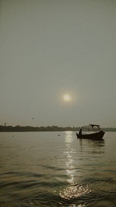 a boat floating on top of a large body of water