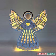 an illuminated angel with wings and heart on it