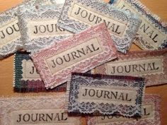 several pieces of cloth with the words journal written on them