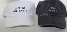 two hats with the words wife of the party and husband of the party printed on them