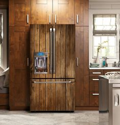 a kitchen with wooden cabinets and stainless steel refrigerator freezer combo in the center, along with white countertops