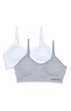 PRICES MAY VARY. This Calvin Klein seamless ruched crop bra is perfect for all day comfort. This set includes two bras Adjustable straps Logo at band Assorted Colors Seamless Bras, Cheap Seamless No-show Sports Bra, Gray Seamless Sports Bra, Calvin Klein Seamless Sports Bra With Medium Support, Calvin Klein Medium Support Seamless Sports Bra, White Seamless Micro-elastic Sports Bra, Calvin Klein Bra Pack, Calvin Klein Girls, Crop Bra