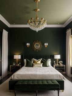 a bedroom with dark green walls and white bedding, chandelier above the bed