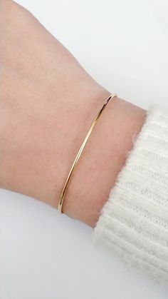 Dainty Thin Gold Cuff Bracelet, Simple Delicate Bangle Bracelet, Adjustable Cuff Bangle bracelet, Stacking bracelet, Dangle Charm bracelet, Gift for herDelicate thin cuff/bangle bracelet with a knot/macrame closure for adjustable length, a tiny heart or leaf charm and beautiful crystal beads. D E T A I L S: Cuff diameter: 62mmCuff thickness: 1.5mmThe cuff and charms are made of brass and they are gold plated with 14K gold. All metallic parts are lead free and nickel freeMacramé/Knot closure for Delicate Golden Bracelet, Gold Band Bracelet For Women, Cute Gold Bracelets Simple, Gold Bangle For Women Classy, Simple Bracelets Gold, Gold Simple Bracelet, Simple Bangles, Adjustable Gold Bracelet, Simple Gold Bracelet