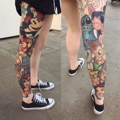 two people with tattoos on their legs are standing in front of each other and one is wearing