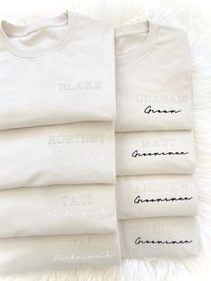 four white t - shirts with writing on them