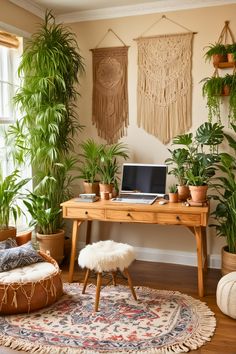 a desk with a laptop on top of it next to potted plants and rugs