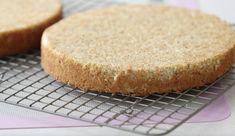 two cookies sitting on top of a cooling rack