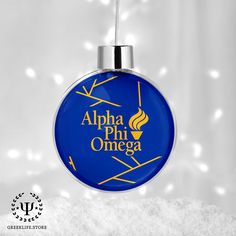 a glass ornament with the words, alpha phi omega on it