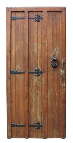 an old wooden door with iron handles