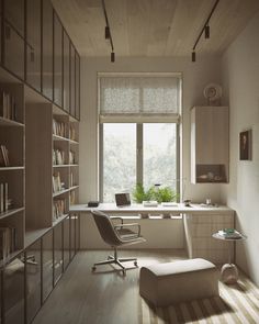 a room with a chair, desk and bookshelf