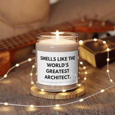 a candle that reads smells like the world's greatest architet on it