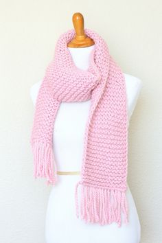 This chunky knit scarf is a cozy addition to any modish fall/winter wardrobe. It's made with wool blend yarn in lovely pink (Blossom) color.The scarf is long, soft and comfy.Please note: I can make this scarf in many other colors. Just contact me for more info.Shown color: Blossom.Machine wash and dry when needed. Pink Knitted Winter Scarves, Pink Knitted Scarves For Winter, Pink Knitted Fall Scarf, Mens Knitted Scarf, Men Scarf, Chunky Knit Scarf, Scarf Chunky, Chunky Knit Scarves, Pink Scarf