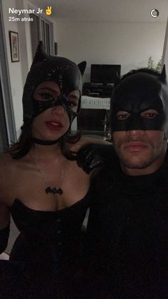 two people dressed up as batman and catwoman