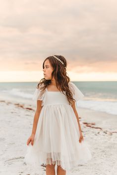 Whimsical like a forest fairy, the Fawn Tulle dress in ivory is our latest tulle creation. The layers of tulle are so soft, while the bodice is smocked in the back for extended wear. Styled for photos, special occasions or everyday, this is a dress she's sure to love. Sizing: Sizing is true to size and flexible. Lengths below are measured from top of bodice to hem (not including sleeves). Front center length: 9-12M - 15 inches12-18M - 16 inches2T - 19 inches3T - 20 inches4T - 21 inches5T - 22 in Indie Boy, Toddler Style, 2025 Wedding, Indie Girl, Spring 2025, Forest Fairy, Rings For Girls, Vow Renewal, Ring Bearer