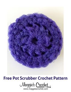 a crocheted pot scrubber is shown in purple