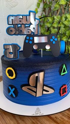 a blue cake with video game controllers on it