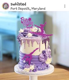 a purple and white cake on a table