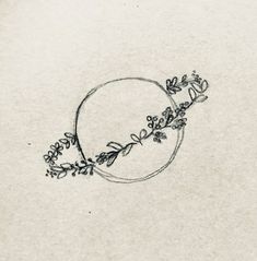 a drawing of a circle with flowers on it