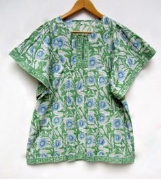 "ITEM DESCRIPTION green blue printed blouse tops - split neckline Indian style blouse - short sleeve blouse Features : short sleeve, Henley neck, Blouse Material : Cotton cambric Fabric: 100% cotton soft light weight ethnic print fabrics Sleeve Length = 9 inch For more sizes & their measurement, please refer our below chart to understand the sizes variations available with us For your size requirement, please mention your size in seller note at the time of buying. IMPORTANT NOTE: - SIZE MEASUREM Green Half-sleeve Top For Vacation, Green Half Sleeve Tops For Vacation, Green Half Sleeve Top For Vacation, Green Half Sleeve Tops For The Beach, Green Half Sleeve Blouse For Summer, Green Half Sleeve Summer Tops, Patterned Short Sleeve Blouse For Vacation, Green Cotton V-neck Blouse, Printed Short Sleeve Blouse For Vacation