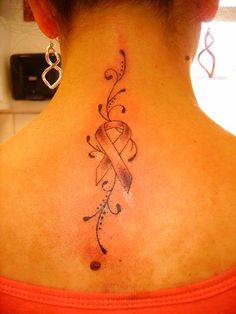 a woman with a tattoo on her neck has a ribbon in the shape of a heart