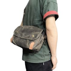 The Men's Canvas Shoulder Bag is a stylish choice for men who are looking for a practical and masculine bag. Made of sturdy canvas with a vintage look, this bag is built to last! A Small Waxed Canvas Crossbody Bag ideal for your travels The men's canvas shoulder bag has a very masculine look with its sleek and stylish design. The flap with snap adds a touch of sophistication to your outfit. The choice of canvas as the material of manufacture adds a vintage touch that will appeal to retro style l Rugged Canvas Shoulder Bag For Travel, Rugged Canvas Travel Shoulder Bag, Rugged Shoulder Bag With Canvas Lining For Travel, Rugged Travel Crossbody Bag, Outdoor Waxed Canvas Shoulder Bag With Large Capacity, Vintage Waxed Canvas Bag For Outdoor, Vintage Waxed Canvas Outdoor Bag, Rugged Waxed Canvas Shoulder Bag For Travel, Large Capacity Waxed Canvas Shoulder Bag For Outdoor