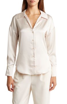 Sleek satin adds liquid shine to a button-up shirt framed by long sleeves for comfort during cooler temps. 27 3/4" length Front placket V-neck Spread collar Long sleeves with button cuffs 95% polyester, 5% spandex Hand wash, line dry Imported Satin Long Sleeve, Nordstrom Rack, Button Up Shirts, Shirt Blouses, Champagne, Button Up, Top Blouse, Hand Wash, Sleek