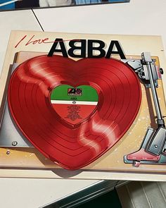 an ad for abra records with a heart shaped record