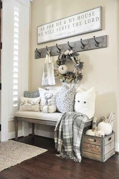 the entryway is decorated with white pumpkins and other decorations