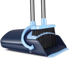 a black and blue dustpan with two brooms on it's sides, in front of a white background