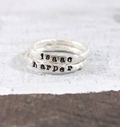 Silver Stacking Name Rings These beautiful keepsakes rings are absolutely gorgeous. They are made competely in our studio from start to finish from .999 pure silver. For MOST people, they will not tarnish like sterling silver, which is .925 silver. Each ring is THICK, so we dont Handmade Everyday Stackable Toe Rings, Handmade Stackable Toe Rings For Everyday, Artisan Ring With Stamped Detail As Gift, Artisan Stamped Rings As Gifts, Handmade Adjustable Rings For Everyday Wear, Customizable Silver Rings For Everyday, Unique Hand Stamped Sterling Silver Rings, Handmade Adjustable Stackable Rings As Gift, Handmade Engraved Ring For Gift With Round Band