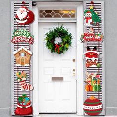 a door decorated with christmas decorations and wreaths